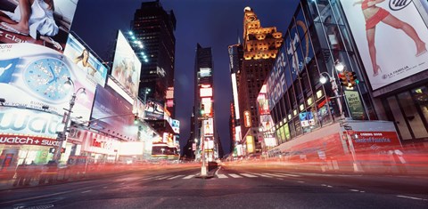 Framed Low angle view of sign boards lit up at night, Times Square, New York City, New York, USA Print