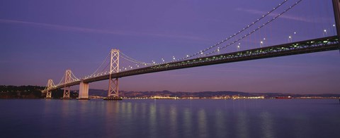 Framed Low angle view of a bridge at dusk, Oakland Bay Bridge, San Francisco, California, USA Print