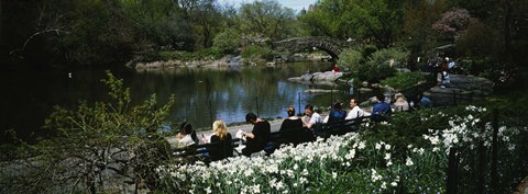 Framed Group of people sitting on benches near a pond, Central Park, Manhattan, New York City, New York State, USA Print