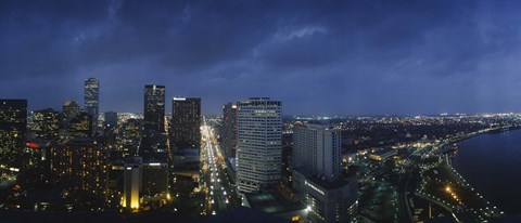 Framed High angle view of buildings in a city lit up at night, New Orleans, Louisiana, USA Print