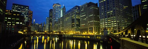 Framed Low angle view of buildings lit up at night, Chicago River, Chicago, Illinois, USA Print