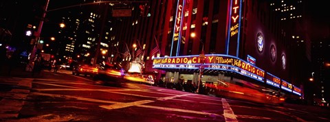 Framed Low angle view of buildings at night, Radio City Music Hall, Rockefeller Center, Manhattan, New York City, New York State, USA Print