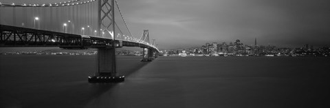 Framed Low angle view of a suspension bridge lit up at night, Bay Bridge, San Francisco, California, USA Print