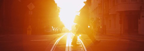 Framed Side profile of a person crossing the cable car tracks at sunset, San Francisco, California, USA Print