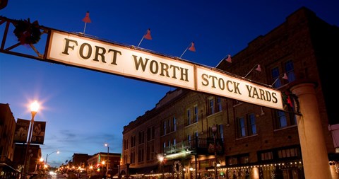 Framed Signboard over a road at dusk, Fort Worth Stockyards, Fort Worth, Texas, USA Print
