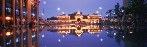 Framed Buildings in an amusement park lit up at dusk, Tivoli Gardens, Copenhagen, Denmark Print