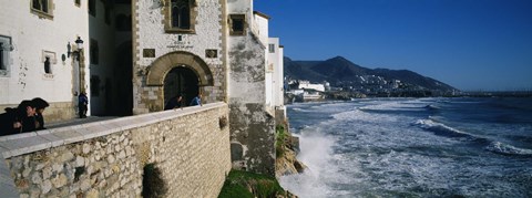 Framed Tourists in a church beside the sea, Sitges, Spain Print