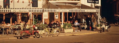 Framed Tourists sitting in a cafe, Sitges Beach, Catalonia, Spain Print