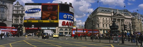 Framed Commercial signs on buildings, Piccadilly Circus, London, England Print