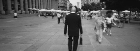 Framed Rear view of a businessman walking on the street, Stuttgart, Germany Print