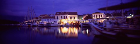 Framed Greece, Cephalonia, Light illuminated on harbor and outdoors cafe Print