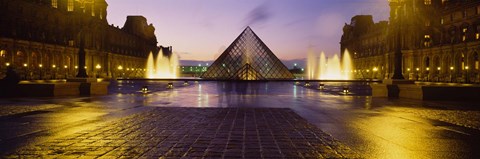 Framed Museum lit up at night with ghosted image of three men, Louvre Museum, Paris, France Print