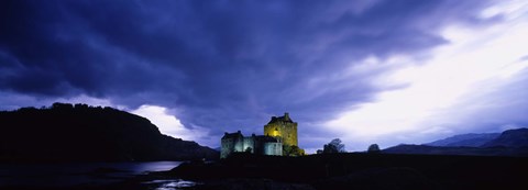 Framed Low Angle View Of A Castle Lit Up At Dusk, Eilean Donan Castle, Highlands, Scotland, United Kingdom Print