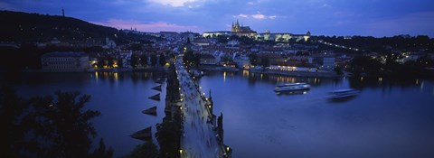 Framed High angle view of buildings lit up at dusk, Charles Bridge, Vltava River, Prague, Czech Republic Print