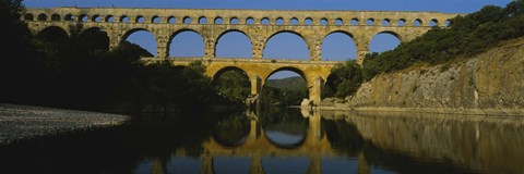 Framed Reflection of an arch bridge in a river, Pont Du Gard, France Print