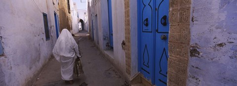 Framed Rear view of a woman walking on the street, Medina, Kairwan, Tunisia Print