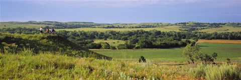 Framed Three mountain bikers on a hill, Kansas, USA Print