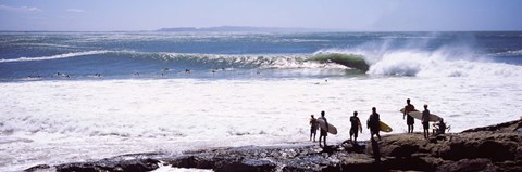 Framed Silhouette of surfers standing on the beach, Australia Print