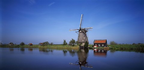 Framed Reflection of a traditional windmill in a lake, Netherlands Print