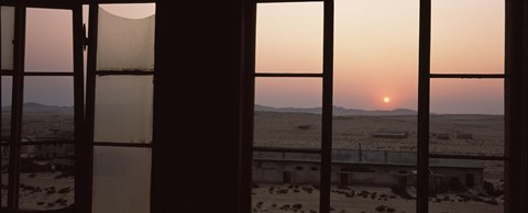 Framed Sunrise viewed through a window, Sperrgebiet, Kolmanskop, Namib Desert, Namibia Print