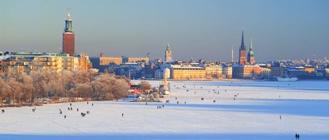 Framed People strolling across frozen Riddarfjarden, Riddarholmen, Stockholm, Sweden Print