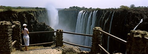 Framed Woman looking at the Victoria Falls from a viewing point, Zambia Print