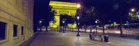 Framed France, Paris, Arc de Triomphe lit up at night Print