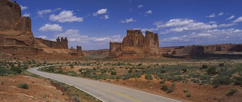 Framed Empty road running through a national park, Arches National Park, Utah, USA Print