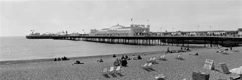 Framed Tourists on the beach, Brighton, England Print