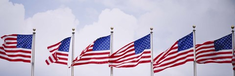 Framed Low angle view of American flags fluttering in wind Print