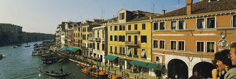 Framed Tourists looking at gondolas in a canal, Venice, Italy Print