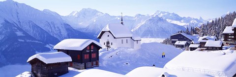 Framed Snow Covered Chapel and Chalets Swiss Alps Switzerland Print