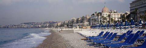 Framed Empty lounge chairs on the beach, Nice, French Riviera, France Print