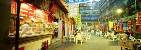 Framed Group of people sitting outside a restaurant, Beijing, China Print