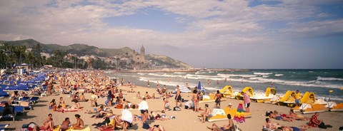 Framed Tourists on the beach, Sitges, Spain Print