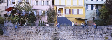 Framed Low Angle View Of A Group Of People Sitting On A Wall, Tubingen, Baden-Wurttemberg, Germany Print