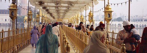 Framed Group of people walking on a bridge over a pond, Golden Temple, Amritsar, Punjab, India Print