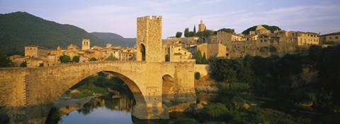 Framed Arch bridge across a river in front of a city, Besalu, Catalonia, Spain Print