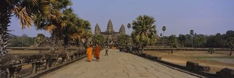 Framed Two monks walking in front of an old temple, Angkor Wat, Siem Reap, Cambodia Print