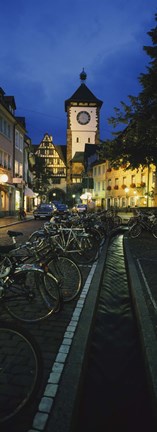 Framed Bicycles parked along a stream near a road, Freiburg, Baden-Wurttemberg, Germany Print
