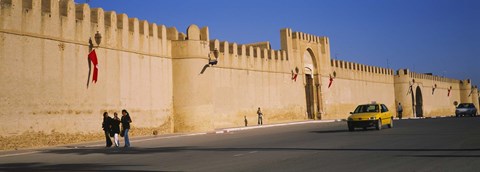 Framed Car on a road in front of a fortified wall, Medina, Kairwan, Tunisia Print