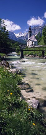 Framed Bridge over stream below country church, Bavarian Alps, Germany. Print