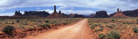 Framed Dirt road through desert landscape with sandstone formations, Utah. Print