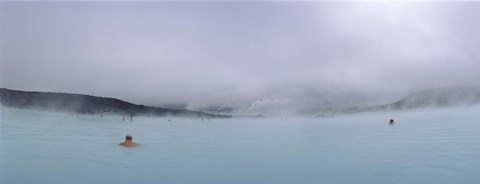 Framed Tourist swimming in a thermal pool, Blue Lagoon, Reykjanes Peninsula, Reykjavik, Iceland Print