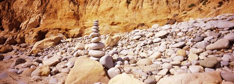 Framed Stack of stones on the beach, California, USA Print