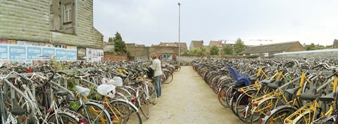 Framed Bicycles parked in the parking lot of a railway station, Gent-Sint-Pieters, Ghent, East Flanders, Flemish Region, Belgium Print