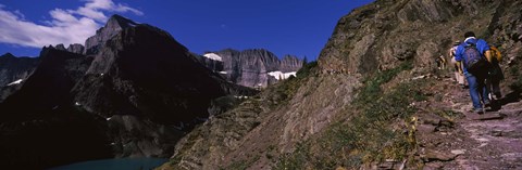 Framed Hikers hiking on a mountain, US Glacier National Park, Montana, USA Print