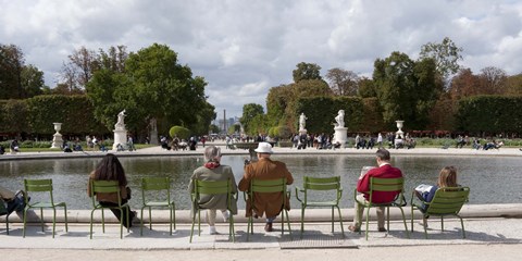 Framed Tourists sitting in chairs, Jardin de Tuileries, Paris, Ile-de-France, France Print