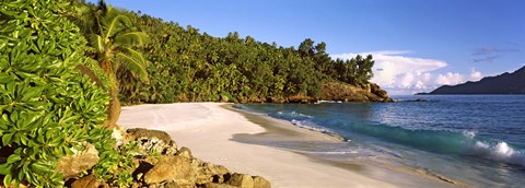 Framed Waves breaking on a small secluded beach on North Island, Seychelles Print