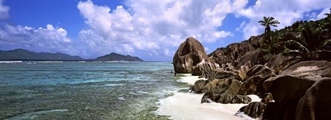 Framed Rock formations on the beach on Anse Source d&#39;Argent beach with Praslin Island in the background, La Digue Island, Seychelles Print